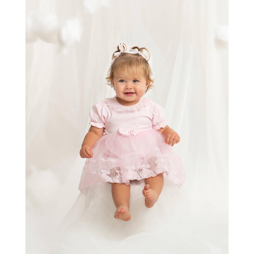 Caramelo pink lace baby dress with matching headband. Elegant tulle, bow and lace details make this the perfect outfit for birthdays, christenings and special occasions.