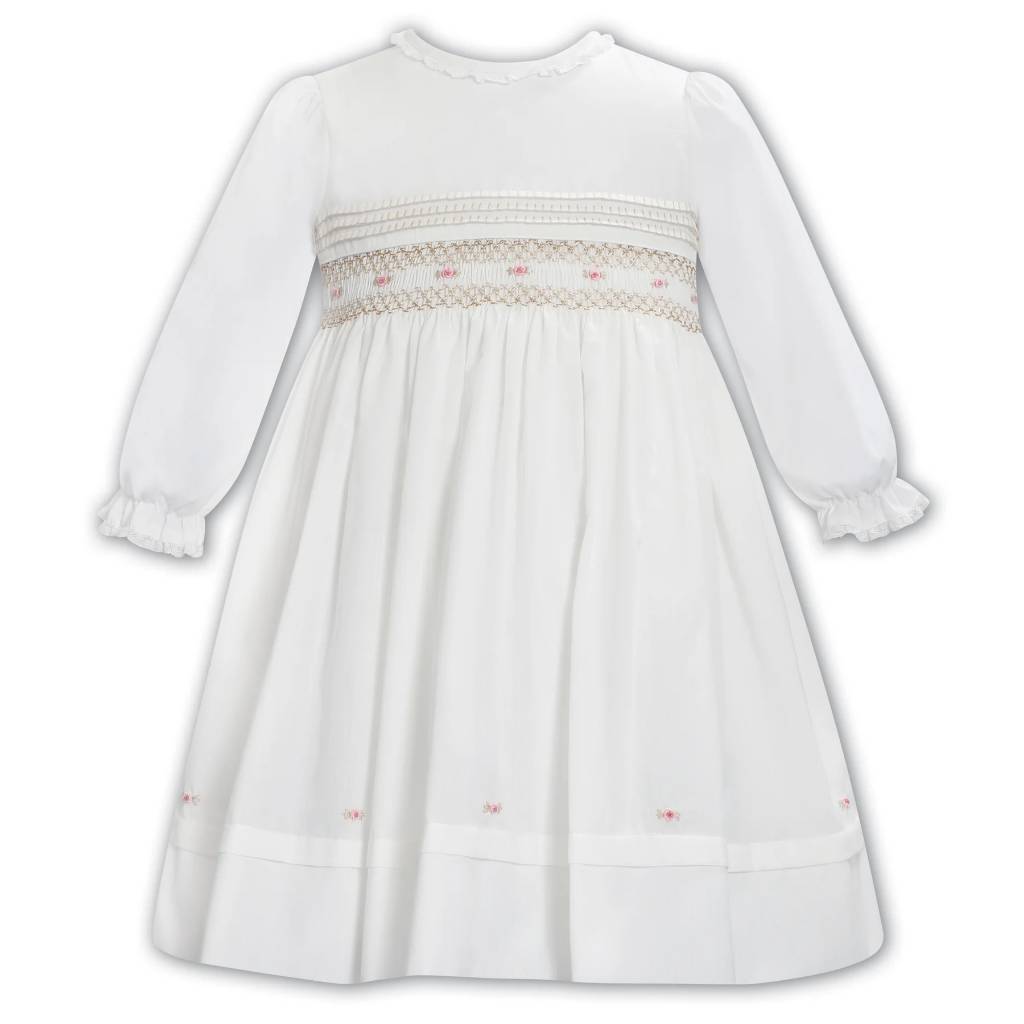 White dress with lace details on a white background