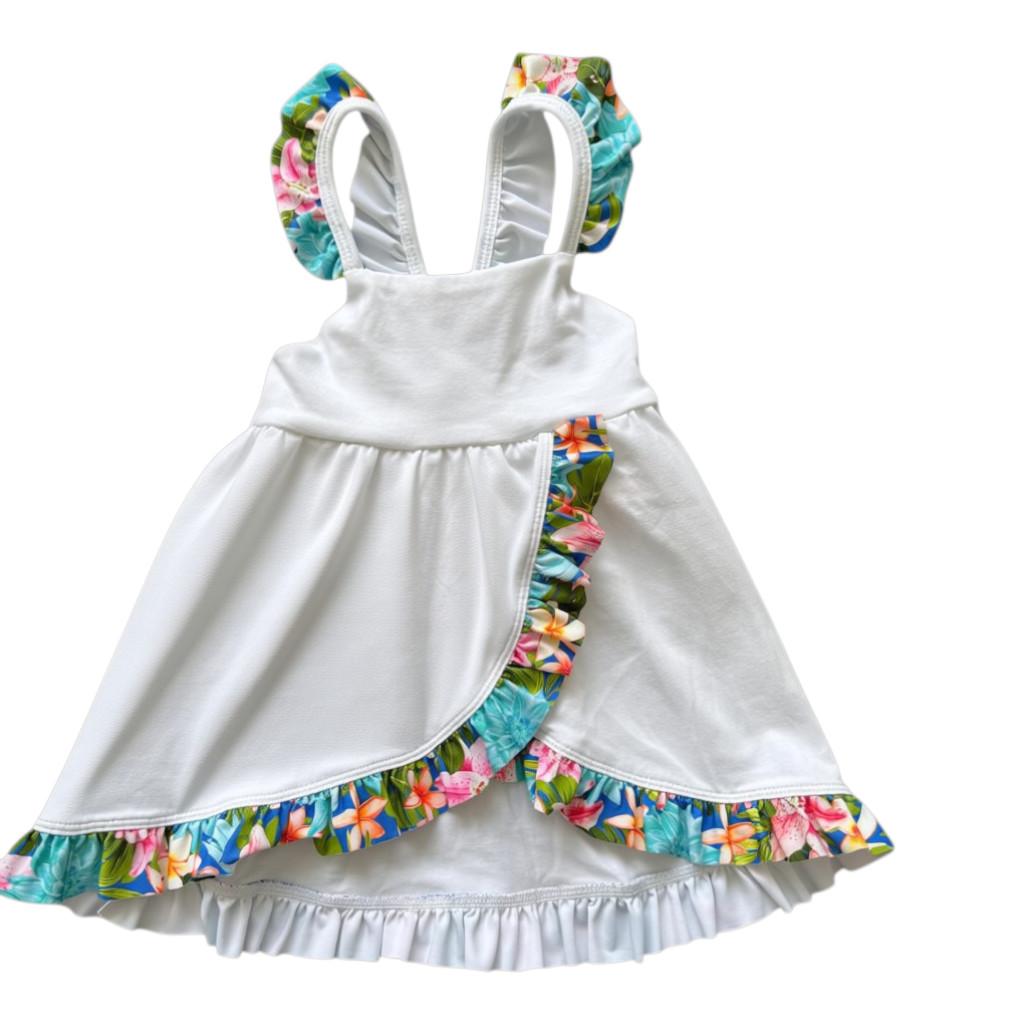 White baby dress with colorful floral ruffles on a white background