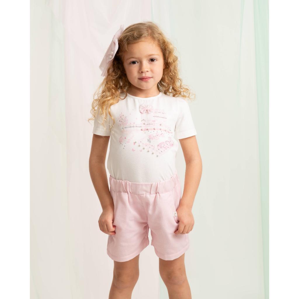 Caramelo pink short set with bow‑detail top and soft matching shorts.