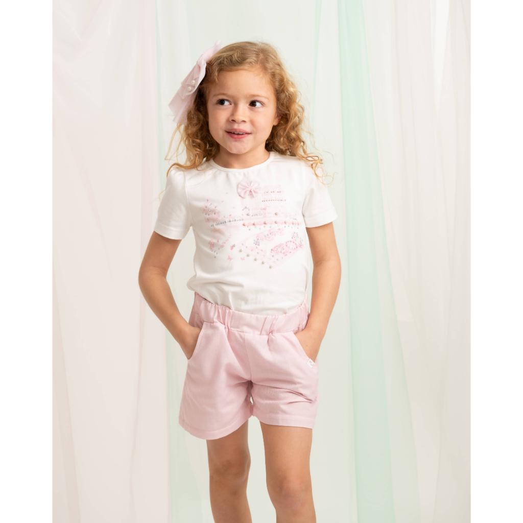 Caramelo pink short set with bow‑detail top and soft matching shorts.